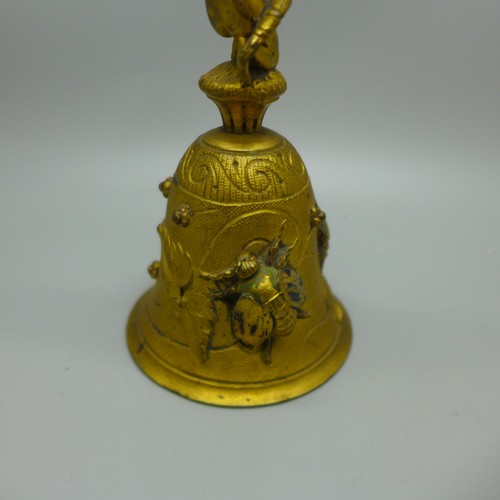 838 - A Victorian aesthetic movement gilt bronze bell with cherub, beetle and insect detail, 118mm