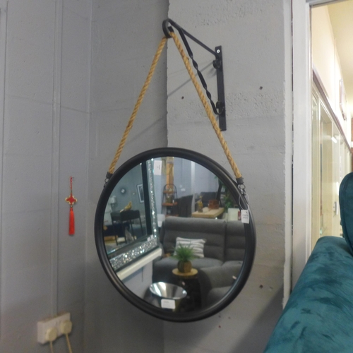 1315 - A medium black metal mirror on hanging rope, 46cms (JRG1809)   #