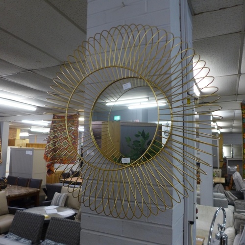 1393 - A gold circular wire mirror