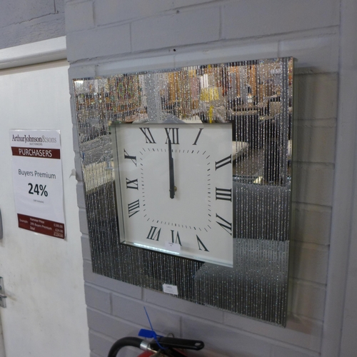 1403 - A mirrored wall clock, H 50cms (PHCL22025)   #