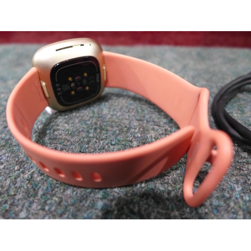 3065 - Fitbit Versa Smartwatch  - Pink/Gold, original RRP £124.99 + VAT (273-17) * This lot is subject to V... 