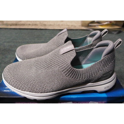 3143 - A pair of women's grey slip-on Skechers, UK size 7, with box * this lot is subject to VAT