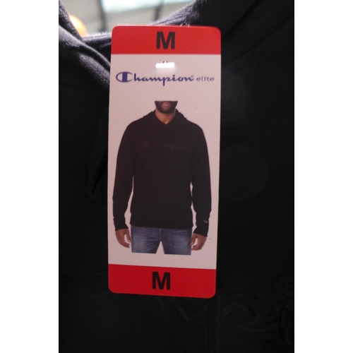 3186 - Men's Champion clothing; black hoodie and navy joggers, both size medium * this lot is subject to VA... 