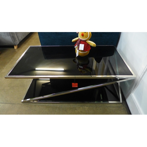 1320 - A chrome and black glass top coffee table