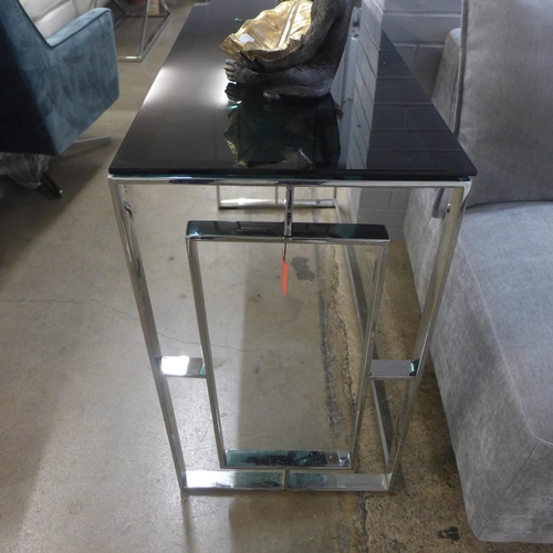 1399 - A chrome and black glass top console table