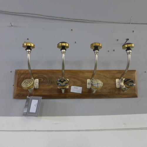 1402 - A rack of four coat hooks with ceramic knobs (HH563916)   #