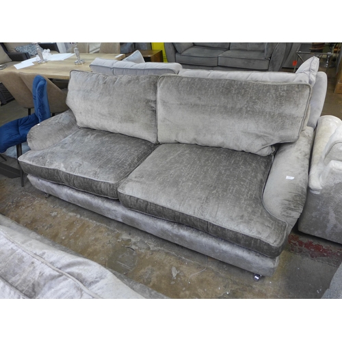 1444 - A mink velvet three seater sofa on chrome castors