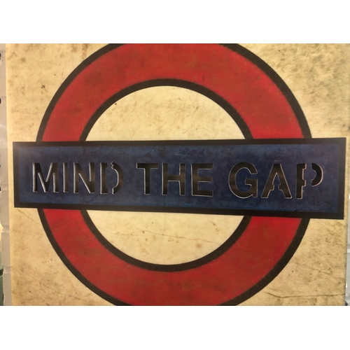 1415 - A 'Mind The Gap' illuminated underground sign