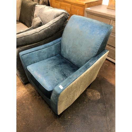 1428 - A blue and grey upholstered armchair