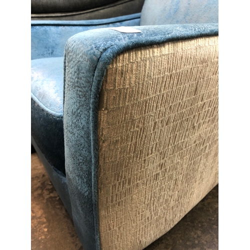 1428 - A blue and grey upholstered armchair