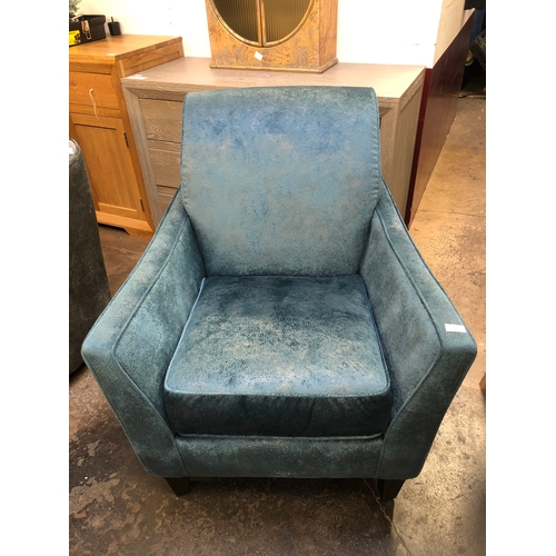 1428 - A blue and grey upholstered armchair