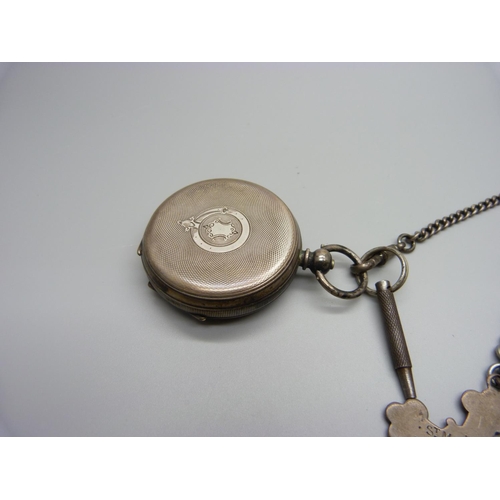 1018 - A silver lever pocket watch, a silver Albert chain and fob