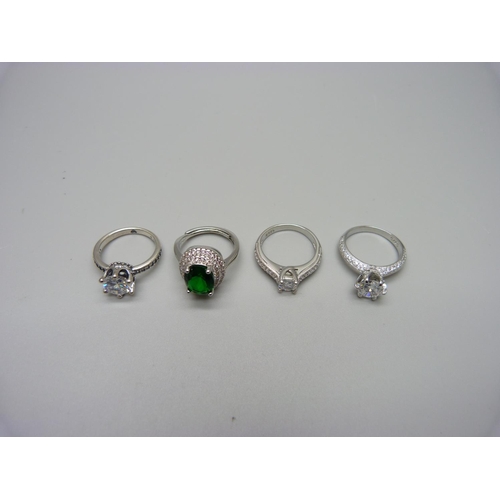 1023 - Four silver dress rings, K, L, L, L