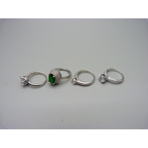 1023 - Four silver dress rings, K, L, L, L