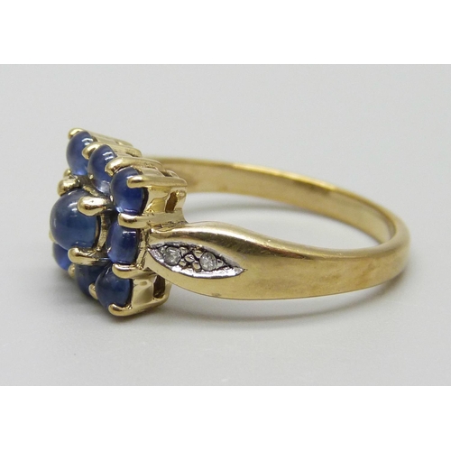 1030 - A 9ct gold, blue stone and diamond ring, 3.6g, N