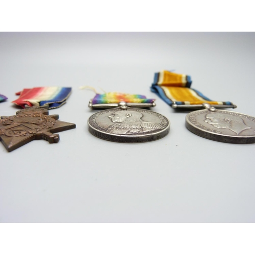 1060 - Four WWI medals, a Distinguished Service Medal, a 1915/15 Star, General Service Medal and British Vi... 