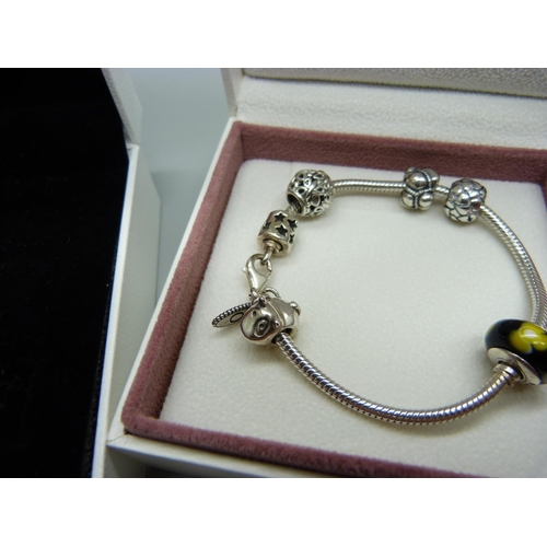 1076 - A silver Pandora charm bracelet with charms and a Pandora clover necklace, both boxed