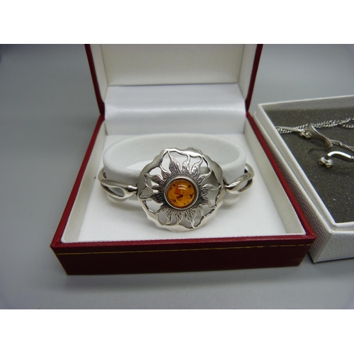 1096 - A silver and amber set bangle, a Kit Heath silver pendant on chain and other silver jewellery