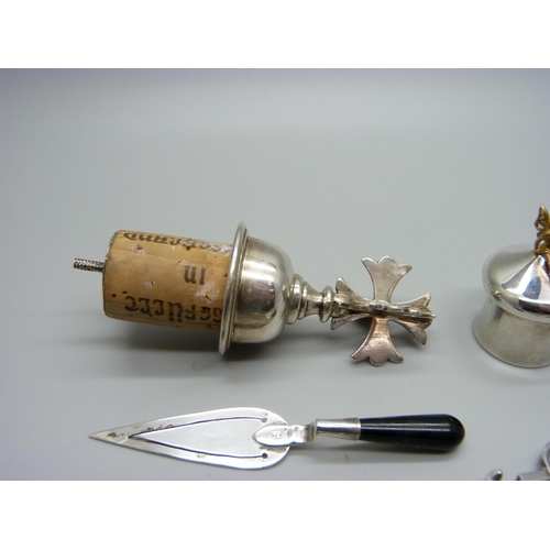 1097 - A silver topped bottle stopper, a pair of Victorian silver sugar nips and other silver items