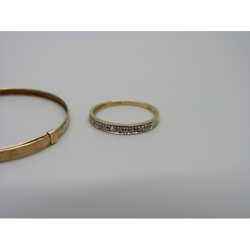 1098 - A 9ct gold hallmarked baby's bangle, 1.2g and a 9ct gold and diamond ring, 1.1g, N