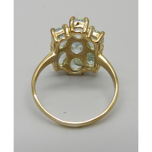 1104 - A silver gilt, sky blue topaz cluster ring, O