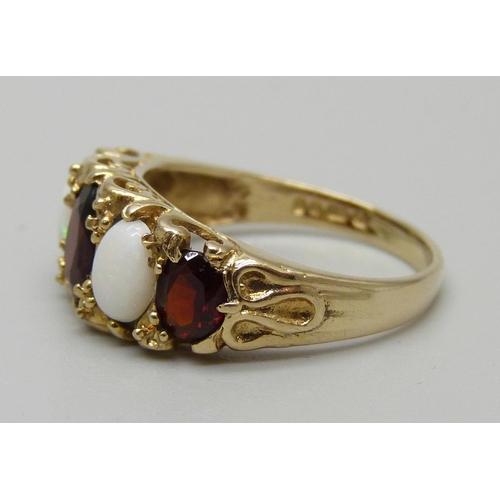 1121 - A 9ct gold, opal and garnet Victorian style ring, 3.1g, P