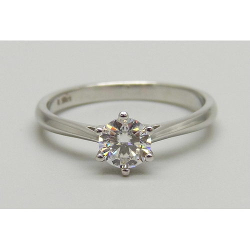 1124 - A white metal and diamond solitaire ring, the shank marked 0.5ct, M