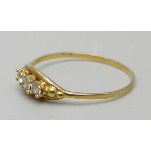 1127 - An 18ct gold, three white stone ring, 1.1g, O