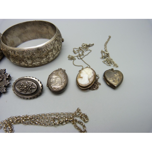 1137 - Two silver bangles, a silver brooch, a silver locket on chain, etc., 93g