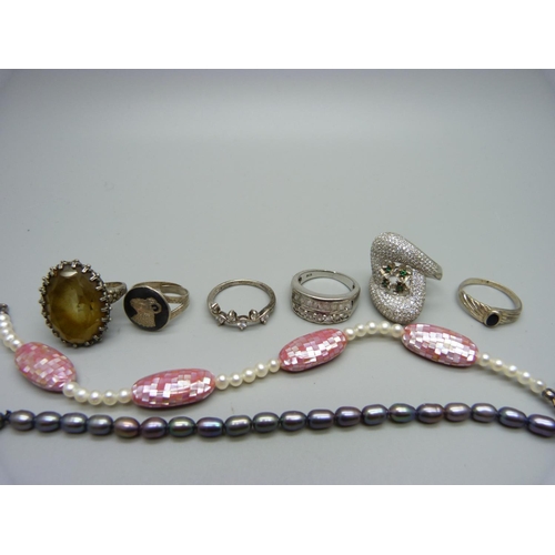 1140 - Six silver rings and three silver mounted gemstone bracelets