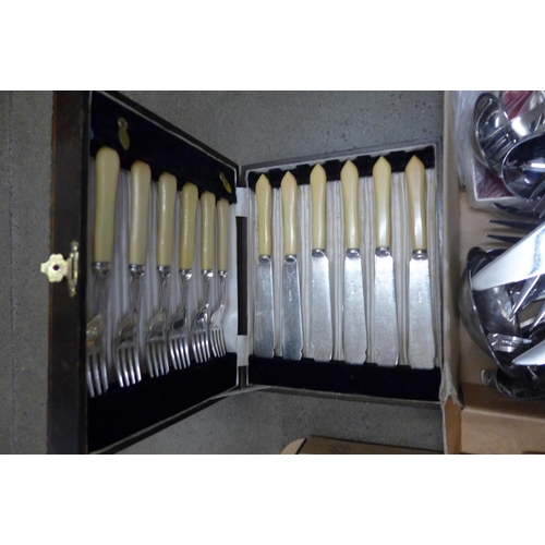 1167 - Two boxes of plated and stainless steel cutlery **PLEASE NOTE THIS LOT IS NOT ELIGIBLE FOR POSTING A... 