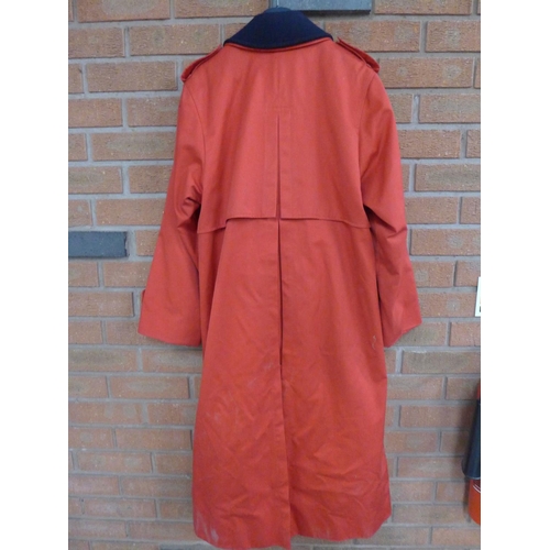 1183 - A lady's Burberry's red raincoat