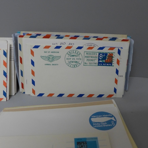 630 - Stamps: a carton of USA postal stationery and first day covers