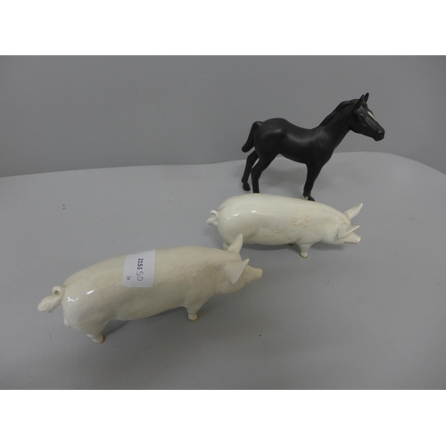 636 - Two Beswick pigs and a horse