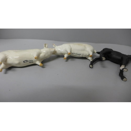 636 - Two Beswick pigs and a horse