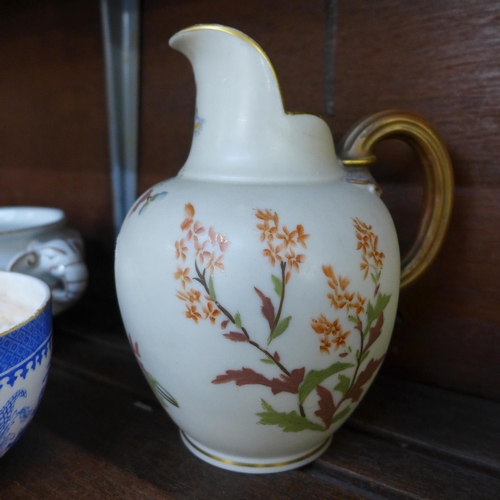 653 - A Royal Worcester blush ivory jug, a blue and white Willow pattern bowl and a chinoiserie bowl (3)