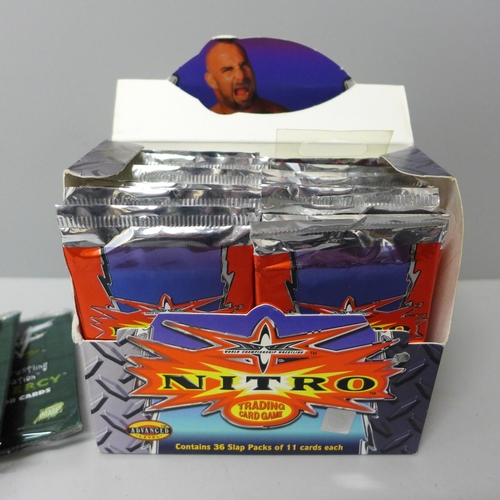 656 - A boxed set of Nitro American wrestling trading cards and other wrestling related trading cards, pac... 