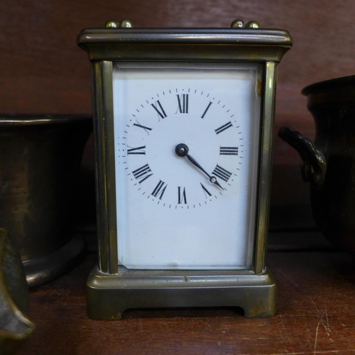 657 - A bronze mortar, brass carriage clock and two other brass items