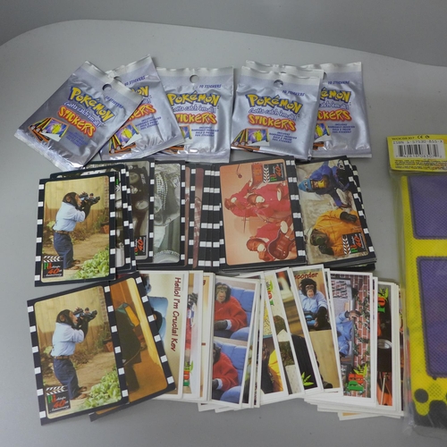 658 - Five Pokemon playing mats and a collection of Pokemon stickers and a collection of PG Tips cards