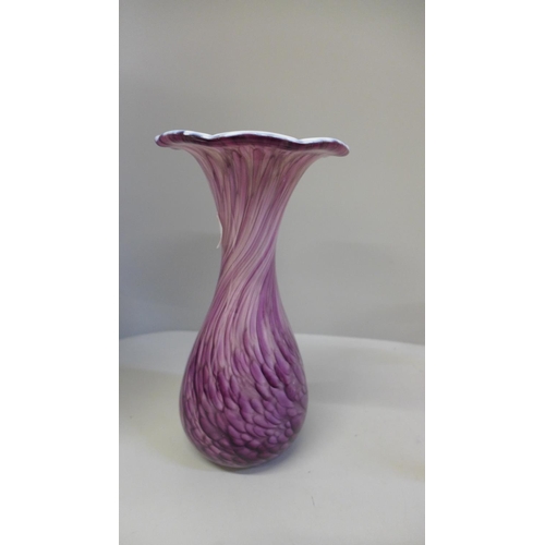 673 - Three items of art glass; an Alum Bay purple and white streaked vase (21 cms), Caithness floral case... 