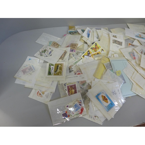 691 - Stamps; a bag of old dealer's display packets