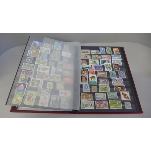 692 - An album of over 500 mint hinged and unhinged stamps, 1930's onwards