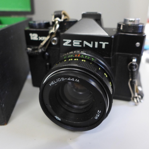 694 - A Zenit 12 x 8 film camera, lens, additional lens and flash, a Rollei XF35 camera and an Olympus-Pen... 