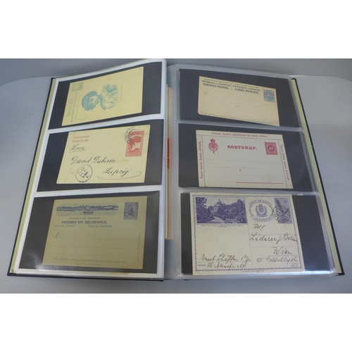 706 - Stamps; an album of Worldwide postal stationery (90)