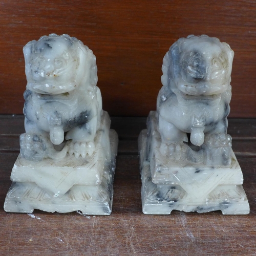 711 - A pair of carved onyx temple dogs, a carved soapstone horse and Chinese elder