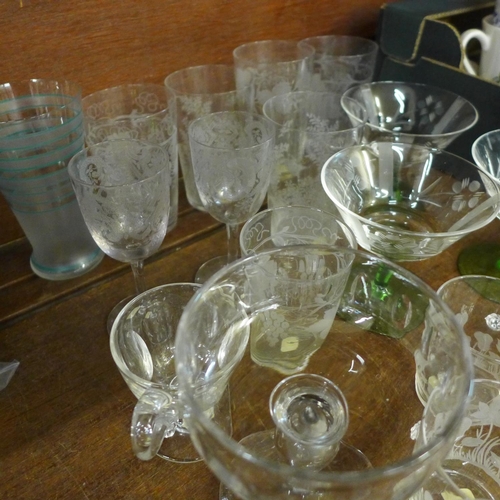 727 - A small collection of etched and cut glass drinking glasses and custard cups