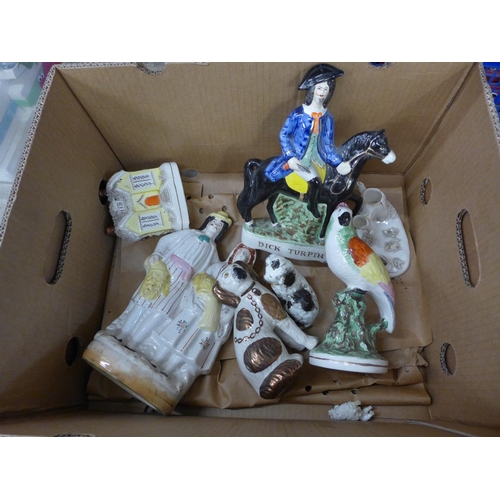 740 - A box of Staffordshire pottery; spaniels, Dick Turpin flatback, Toby jug, a/f, candle lights, etc.