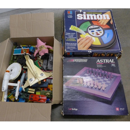 762 - A box of die-cast model vehicles including Captain Scarlet and Thunderbirds, a Simon game and a Kasp... 