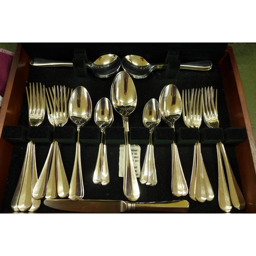 809 - A canteen of stainless steel cutlery and Mappin & Webb silver plated cutlery in rolls