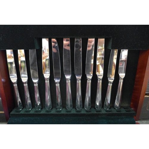 809 - A canteen of stainless steel cutlery and Mappin & Webb silver plated cutlery in rolls